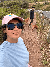 me on a coastal trail with my dogs and a friend