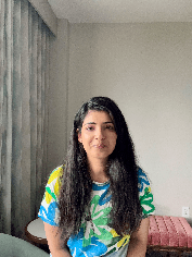 me in a bright floral shirt, indoors